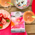 Load image into Gallery viewer, A vibrant flat lay with two pink cocktails, chocolate-covered strawberries, and a Fresh Scents Hello Gorgeous - Sachet 3pk for lasting fragrance, alongside a disco ball on a colorful table setting.

