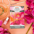 Load image into Gallery viewer, A Fresh Scents Hello Gorgeous - Sachet 3pk flameless air freshener with a bright pink and orange watercolor design rests on a pink surface among orchids, pearls, gold jewelry, and nail polish, promising long-lasting fragrance.
