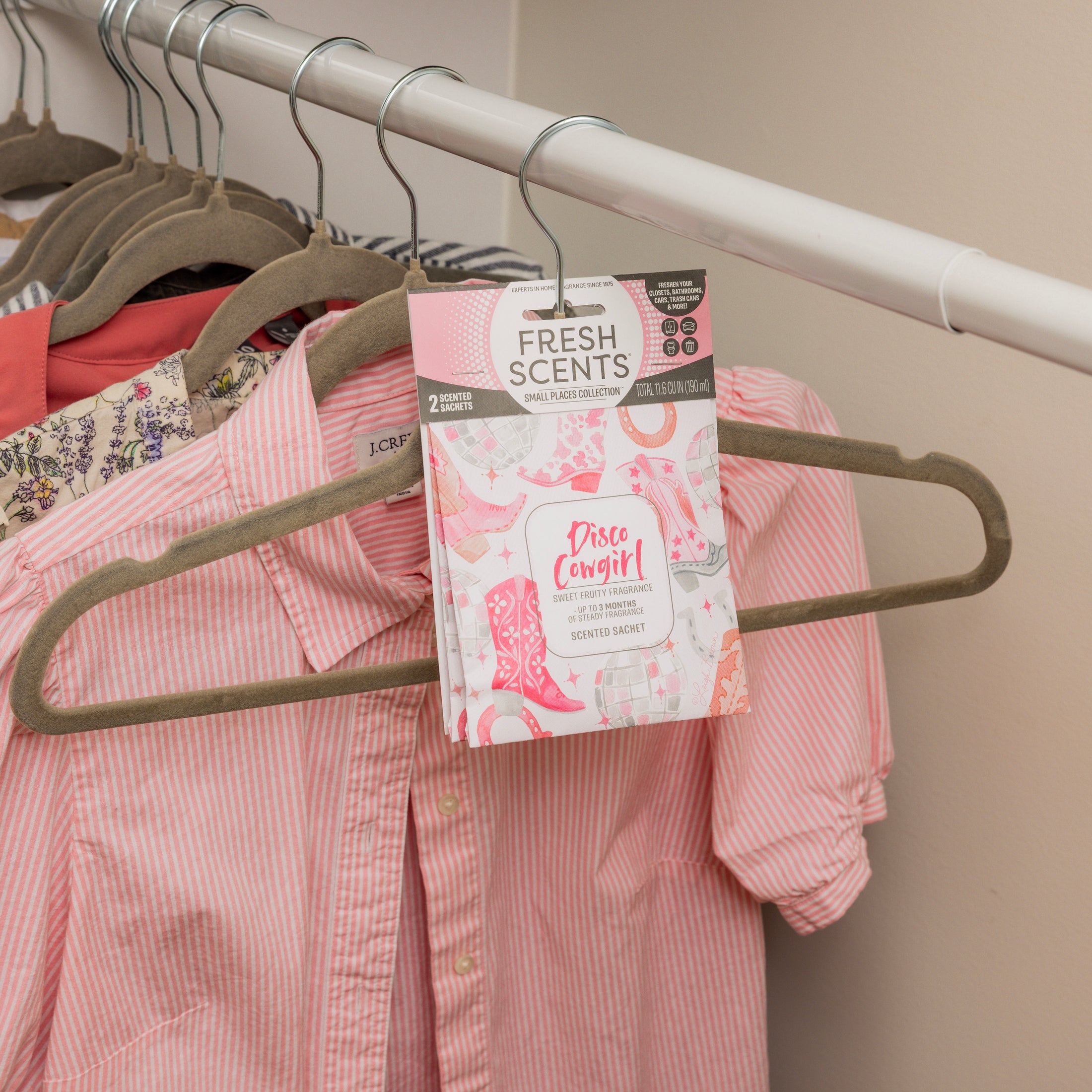The Fresh Scents Disco Cowgirl - Sachet 2pk adds a pink and white scent to your closet, hanging easily to keep wardrobes fresh. Perfect as a small space fragrance and flameless air freshener for clothes storage.