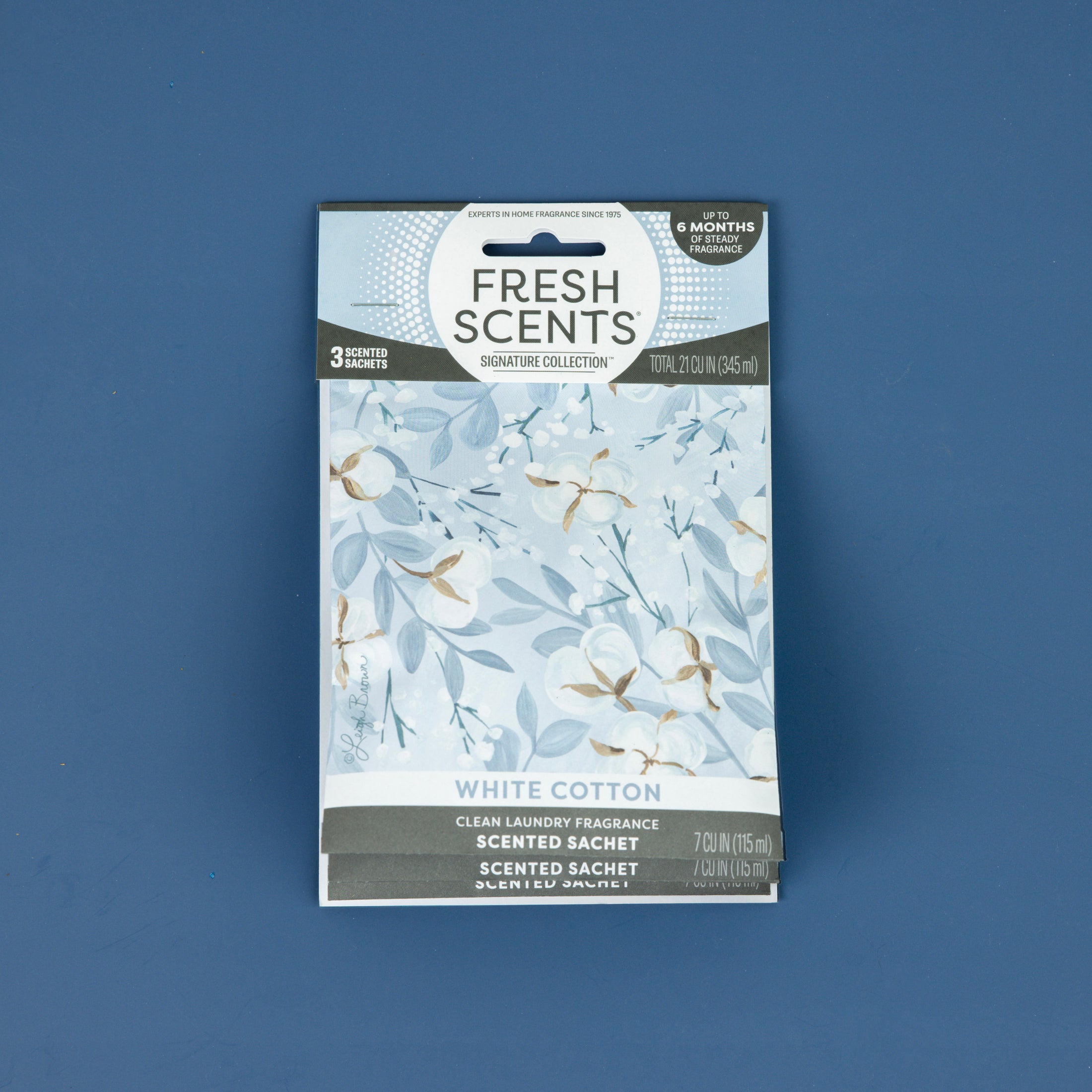 Fresh Scents White Cotton - Sachet 3pk features floral artwork and a clean laundry scent, providing a long-lasting, flameless air freshener option.