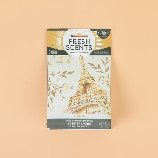 The Fresh Scents Paris - Sachet 3pk features Eiffel Tower and golden floral artwork on a light background, providing a long-lasting flameless air freshener.