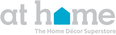 Logo for At Home with the words in light gray lowercase letters; the o in home is replaced by a blue house shape. Below, it says The Home Décor Superstore in smaller gray text.