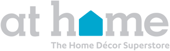Logo for At Home with the words in light gray lowercase letters; the o in home is replaced by a blue house shape. Below, it says The Home Décor Superstore in smaller gray text.